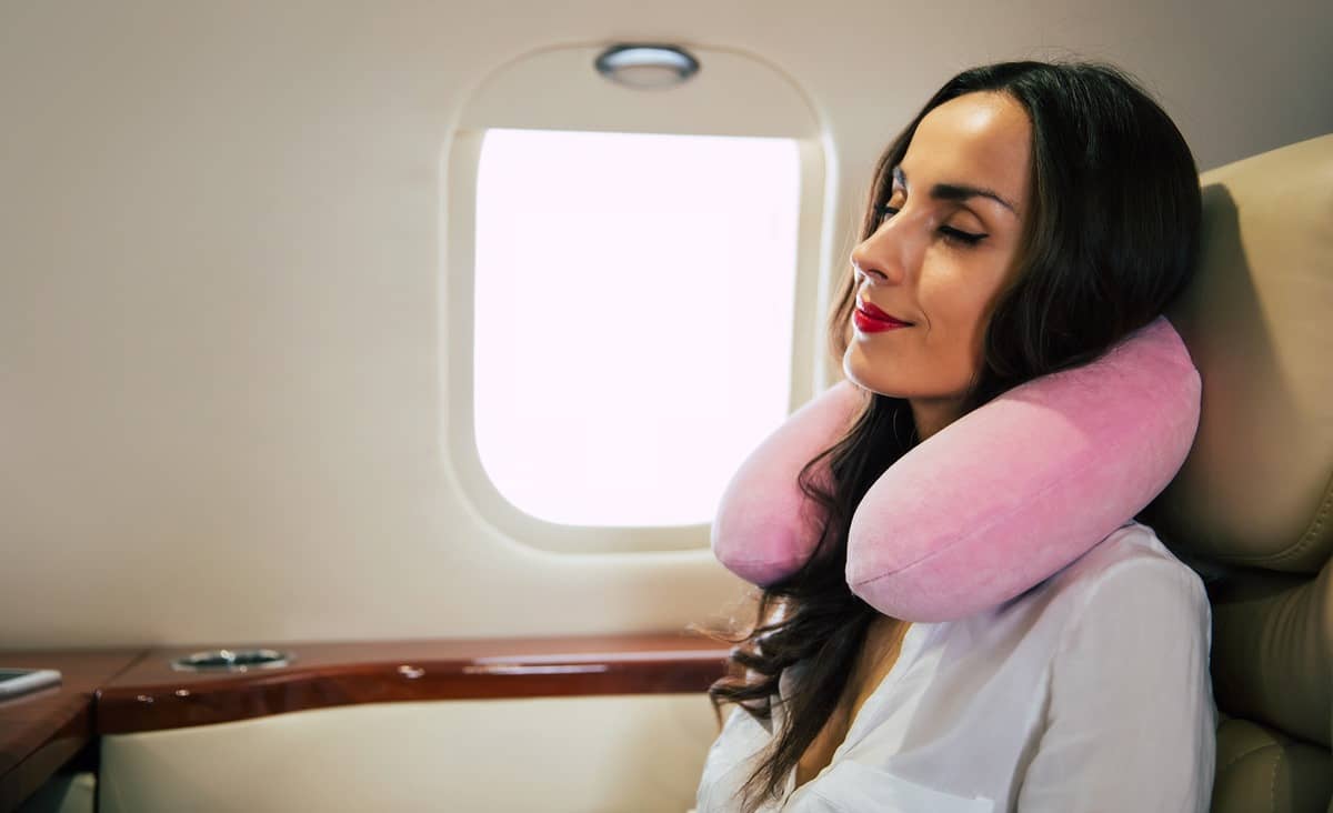 Women passenger asleep on aeroplane